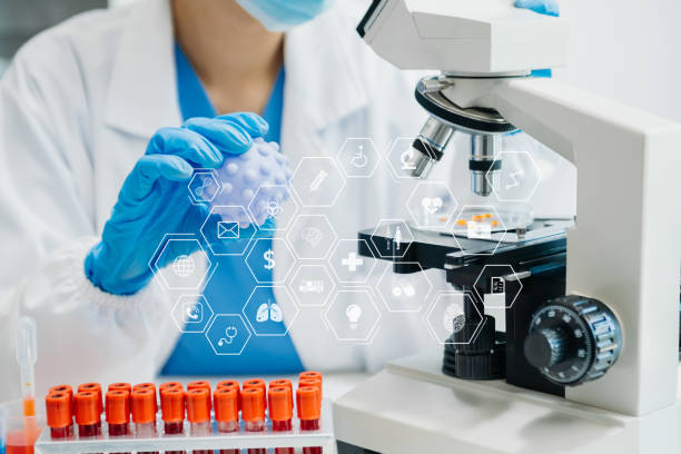 istock DNA molecule testing concepts. The doctor in a mask examines DNA molecules on the chemical laboratory with virtual icon 1686040503
