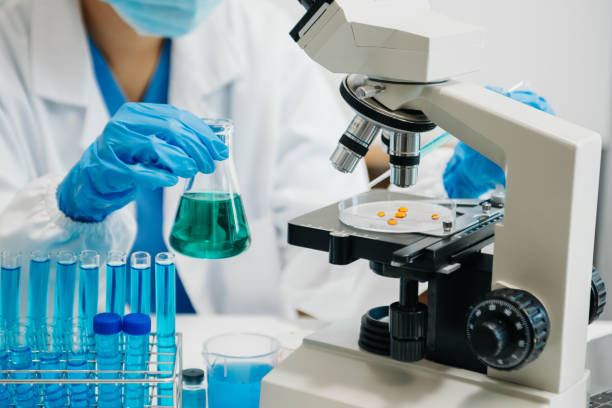 istock Modern medical research laboratory. female scientist working with micro pipettes analyzing biochemical samples, advanced science chemical laboratory 1686040774