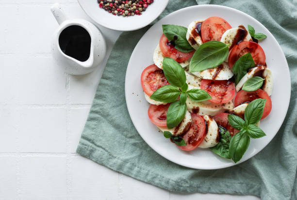 istock Caprese salad with tomatoes, mozzarella and basil. 1686041554