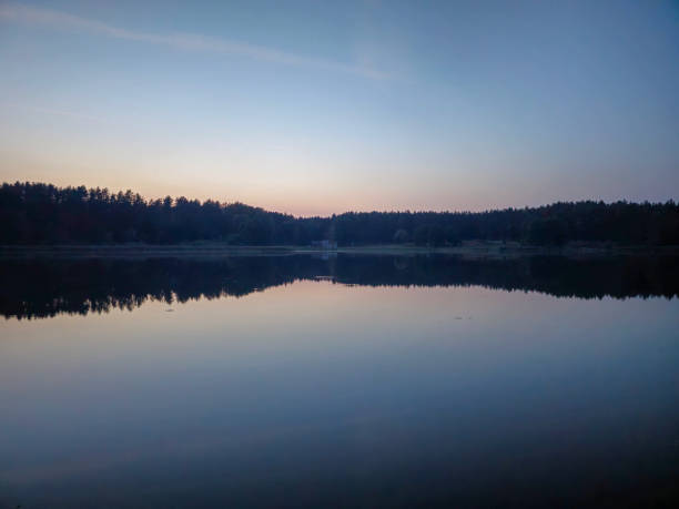 istock lake at sunset. peace of mind 1686074117