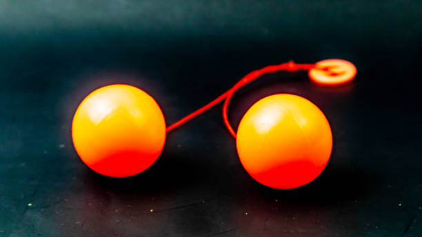 istock toy lato lato orange on black background 1686085600