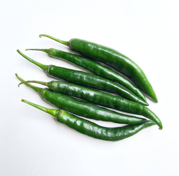 istock fresh green chilies on a white background 1686096198