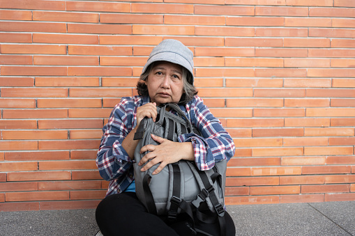 Homeless man on begging on the street. About 45 years old, Caucasian male.