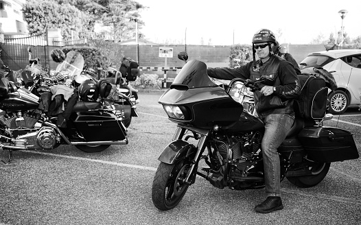 Cecina, Livorno, Tuscany, Italy - May/24/2019: young biker during Harley-Davidson sports event in Tuscany, Italy.