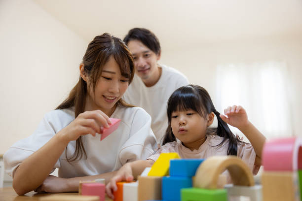 istock Family playing with building blocks at home 1686129824