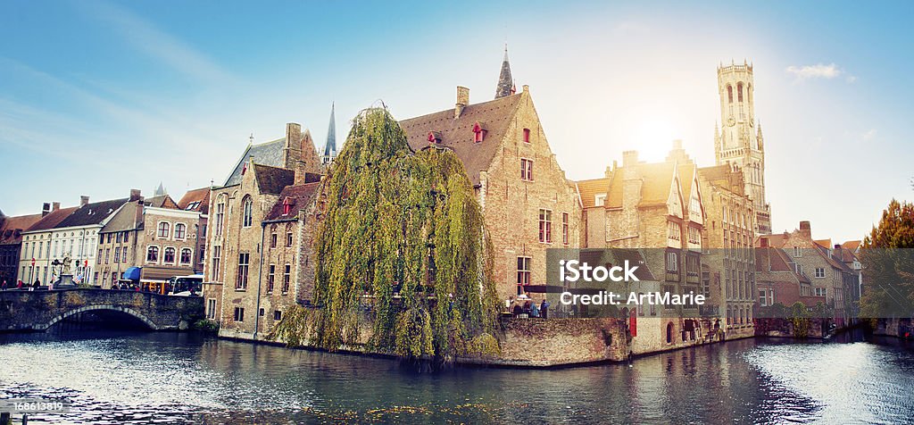 Waterfront Buildings in Bruges, Belgium Panoramic view to the canals of Bruges Bruges Stock Photo