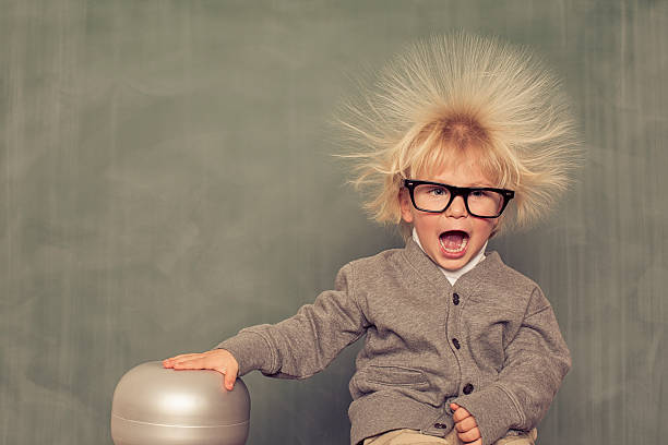Electric Hair A young, intelligent nerd explores the depths of electricity. scientific experiment photos stock pictures, royalty-free photos & images