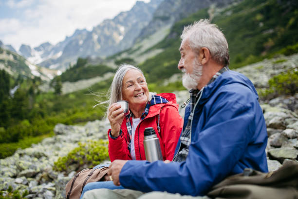 istock Active senior couple hiking together in autumn mountains. 1686142921