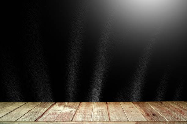 istock Abstract wooden planks against black wavy and light bokeh background. 1686149710