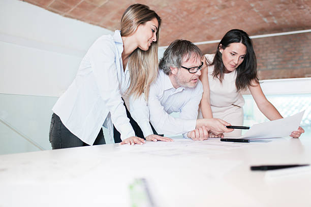 istock Architects and designers on a meeting in their office 168615101