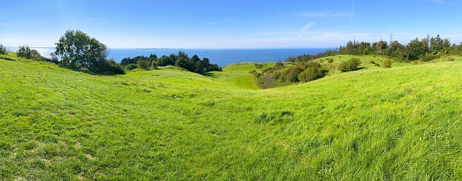 Take in the picturesque scenery of Samsø, showcasing its captivating Ice Age moraine landscape.