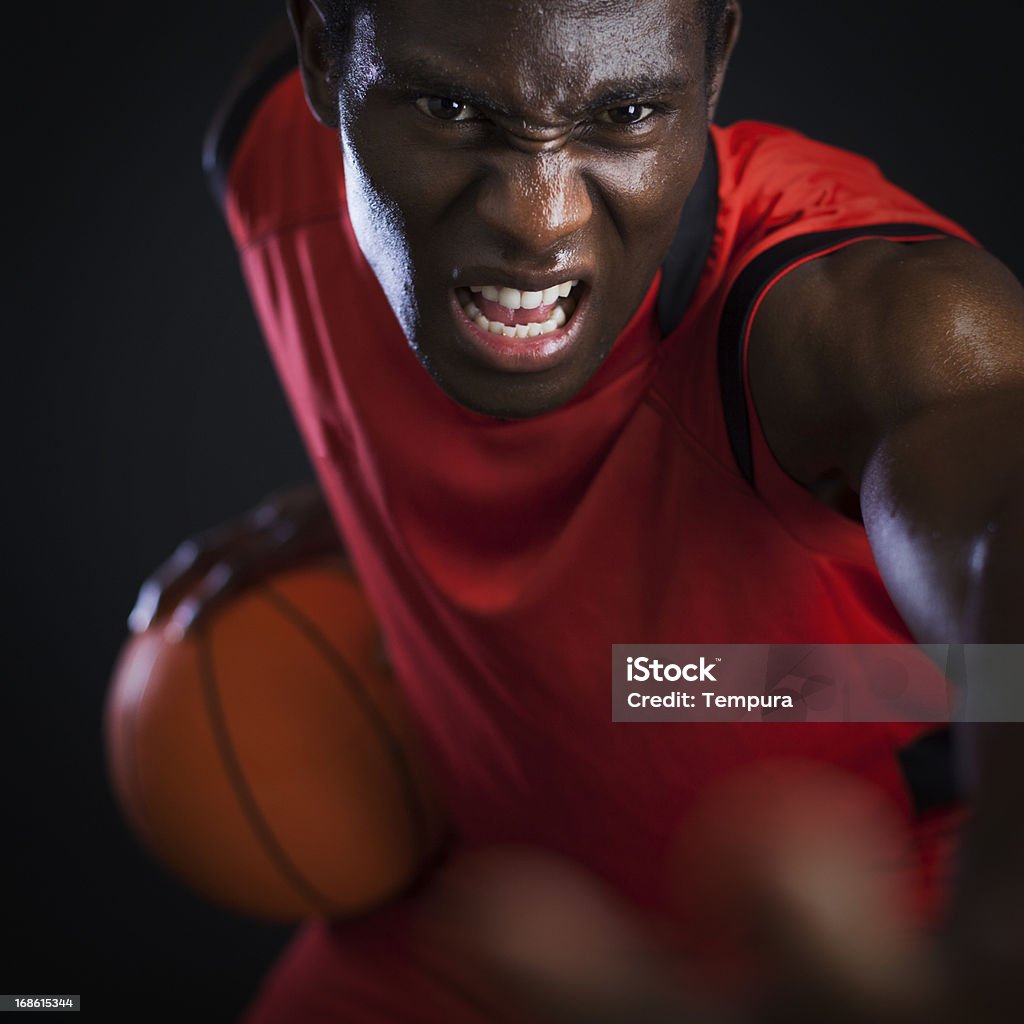 Basketball agressive palyer Playing basketball. More files of this model and series on port. Vertical format. 20-24 Years Stock Photo