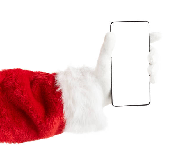 istock Santa hand holding phone with empty screen. Isolated with clipping path 1686163405