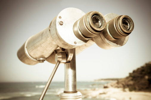 Tourist binoculars at the viewpoint of Santa Catalina Castle in Cadiz, overlooking the sea.
