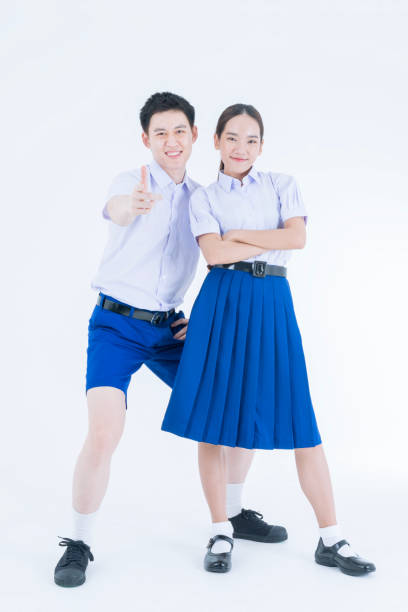 istock Thai student Uniform. Two Asian students standing together. Asian young couple in students uniform on white background. 1686171497