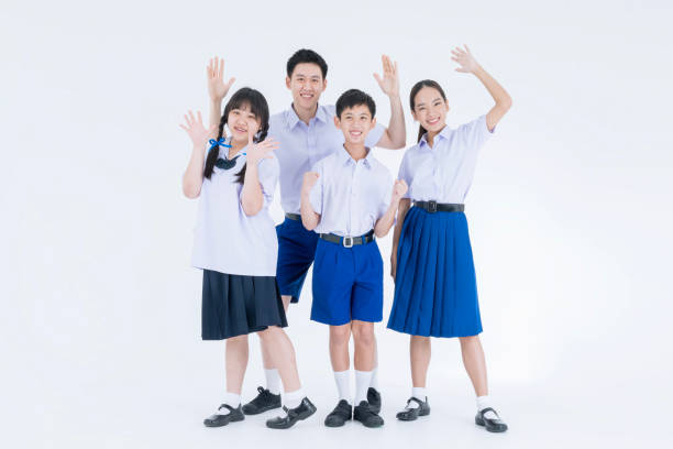 istock Thai students. Group of Asian students wearing school uniforms on a white background. Asian girl and boy in student uniform on white background. 1686186696