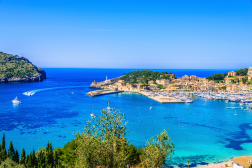 La Badia de Sóller -- the entrance and harbour of the beautiful majorcian bay of Port de Soller (Puerto de Soller), with two lighthouses sitting on the headlands on either side of the bay. 