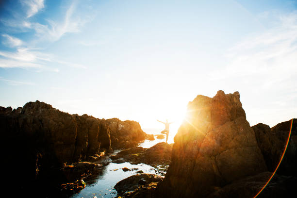 istock Female meditating on the rocks 168620142