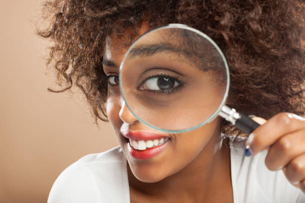 istock Young woman with a loupe 168620511