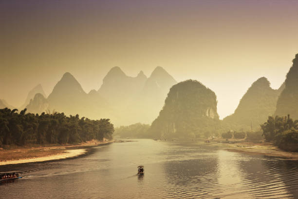 istock Guilin Karst mountains and river lee at sunset 168621334