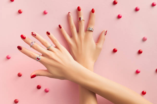 istock Womans hand with rinds on pink background 1686227585