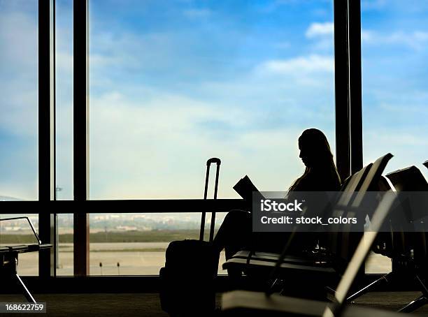 Woman Reading Stock Photo - Download Image Now - Book, Suitcase, 20-24 Years