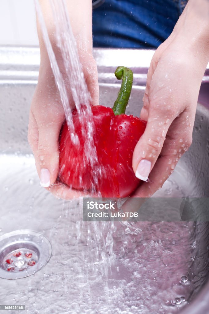 washing fresh vegetables Adult Stock Photo