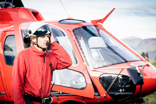 istock paramedic standing by his helicopter 168623954