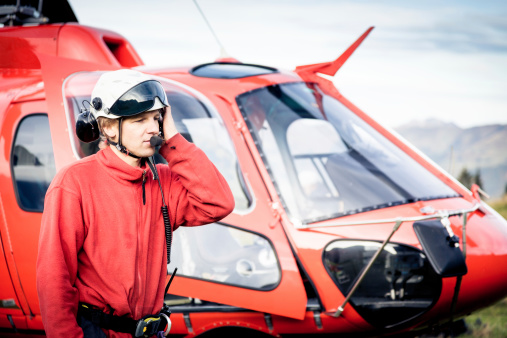 paramedic standing by his helicopter.