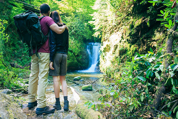 istock young couple hiking 168623961