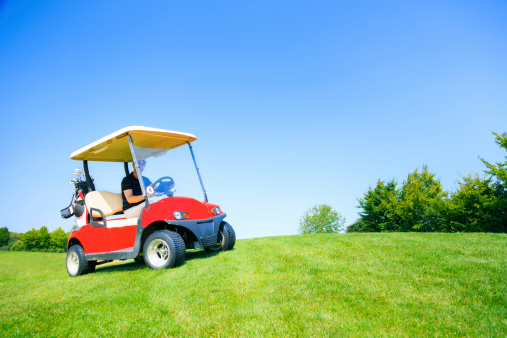 man driving a golf cart
