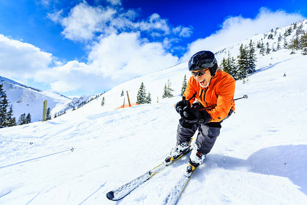 senior man skiing stock photo