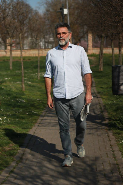 istock Senior man walking trough park 1686243978