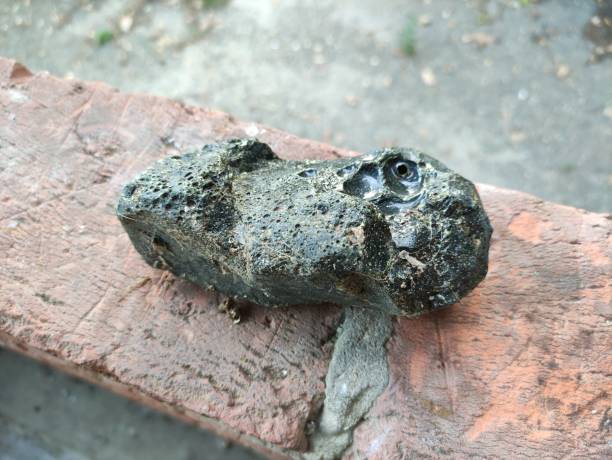 istock Black stone that looks like a meteorite 1686251933