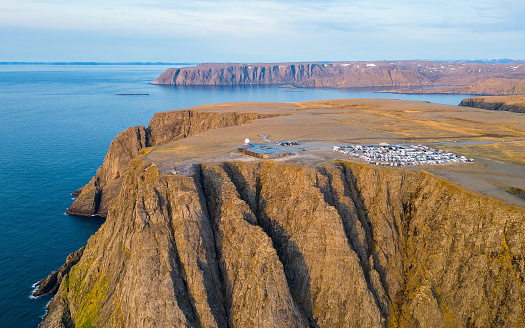 North Cape (Nordkapp) in Norway seen from the air  with the campervan park, tourist center and the famous globe monument