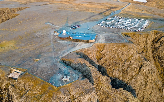 View of Nordkapp monument and campground, the North Cape, Norway, the northernmost point of mainland Norway and Europe, Finnmark County, aerial picture shot from drone