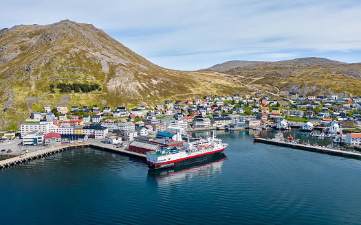 Honningsvåg in Norway with a cruise ship in the harbour with travellers visiting the North Cape