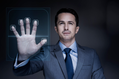 Businessman using biometric hand scanner 