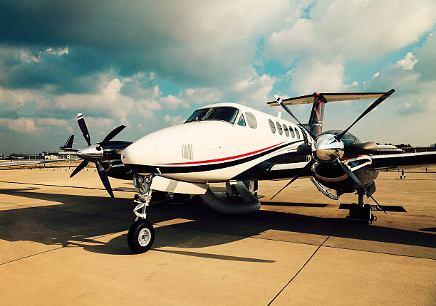 Business plane A small private business jet parked on an airport propeller airplane stock pictures, royalty-free photos & images