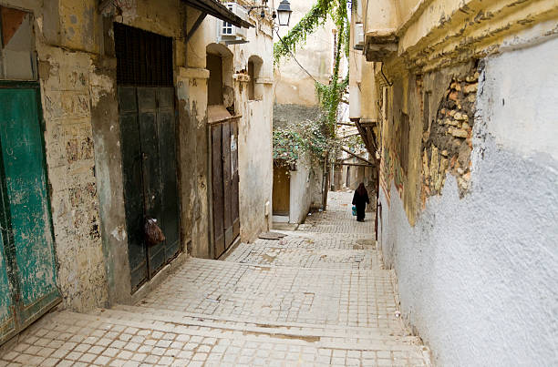 Casbah in Algiers Narrow street in the Casbah of Algiers with an unrecognizable person in the distance. The Casbah is a UNESCO World Heritage site. algiers stock pictures, royalty-free photos & images