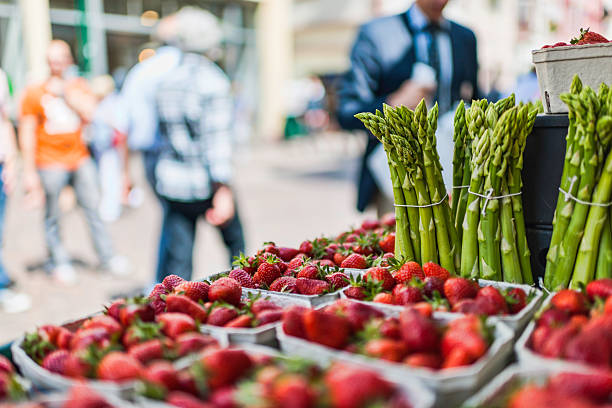 Street Market Sale of strawberries and asparagus on the street in Heidelberg, Germany. heidelberg germany photos stock pictures, royalty-free photos & images