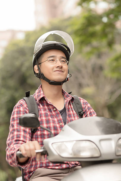 istock Young Asian man drive a motorcycle 168629196