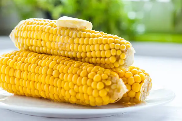 Steamed sweetcorn on the cob with butter