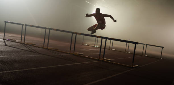 istock Male Runner Training And Jumping Over Hurdles 1686295465