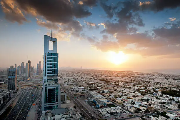 skyscrapers along Sheikh Zayed Road, Burj Khalifa and Burj Al Arab Hotel in Dubai United Arab Emirates at sunset