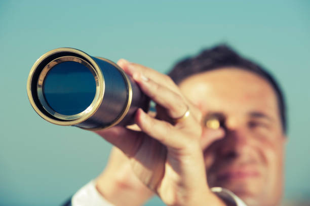 istock The way forward. Businessman looking through a telescope 168631725