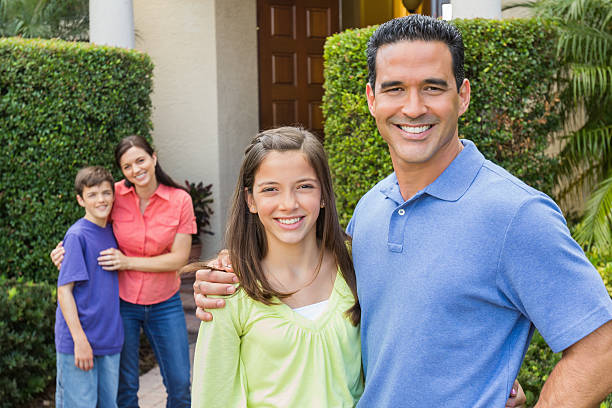 istock Loving Family Standing In Lawn 168632565