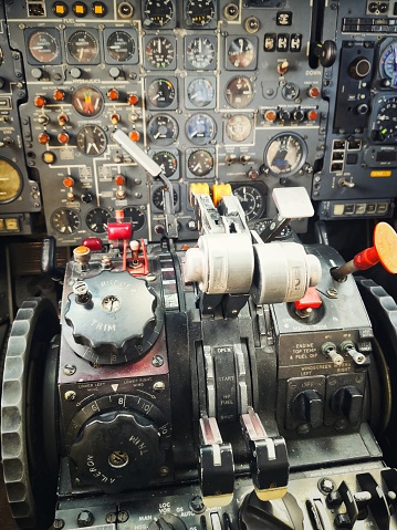 Close up shot of the control panel in a plane cockpit.