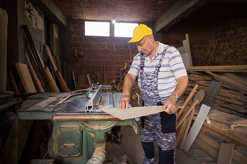 Man carpenter working at his workshop