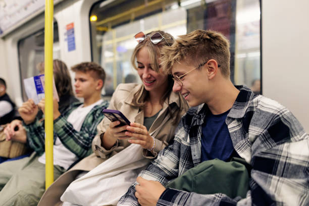 Family travelling in London Underground train